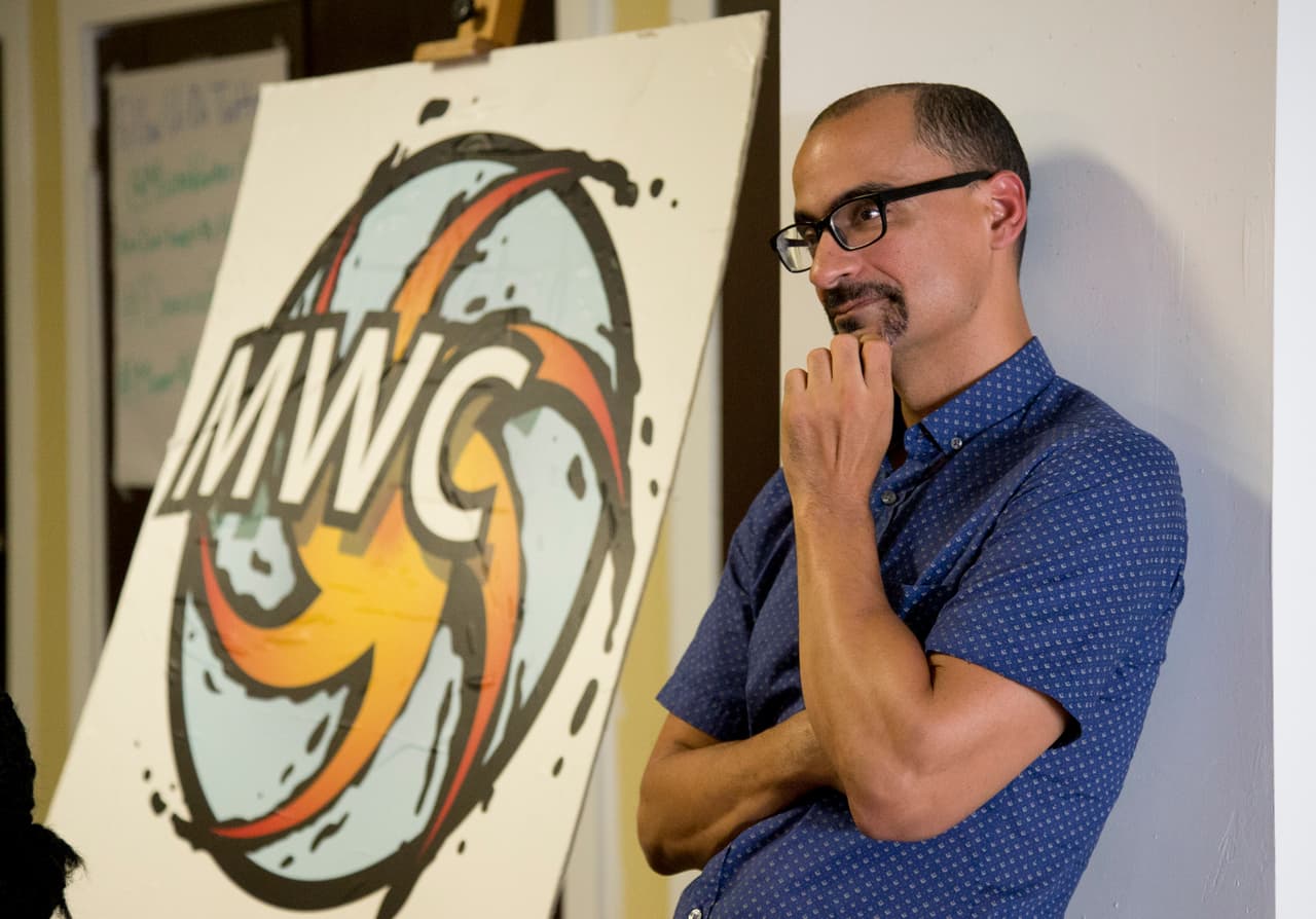 Dominican-American writer Junot Diaz attends a gathering of about 150 activists and community members in Miami on Wednesday, June 24, 2015. The group called for political pressure, travel boycotts and consumer choices over items such as sugar to strip power from the governments and corporations benefiting from a policy that they say targets black migrants. Haiti and the Dominican Republic share the island of Hispaniola, but the countries have long had an uneasy relationship. The Dominican government says it will deport non-citizens who didnt submit applications to establish legal residency before a June 17 deadline. (AP Photo/J Pat Carter)