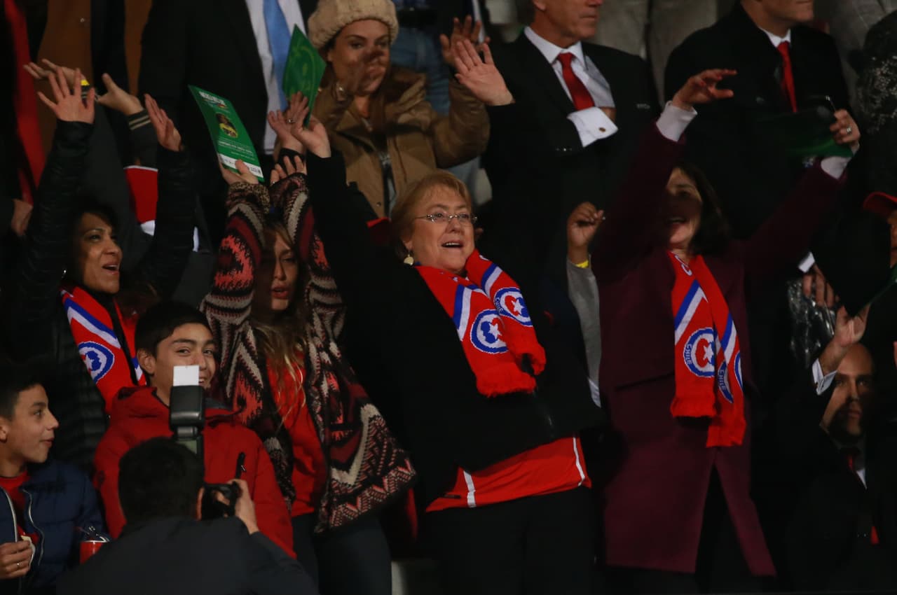 SANTIAGO, CHILE - JUNE 11: Michelle Bachelet, President of Chile waves her hands to cheer for her team during the 2015 Copa America Chile Group A match between Chile and Ecuador at Nacional Stadium on June 11, 2015 in Santiago, Chile. (Photo by Hector Vivas/LatinContent/Getty Images)