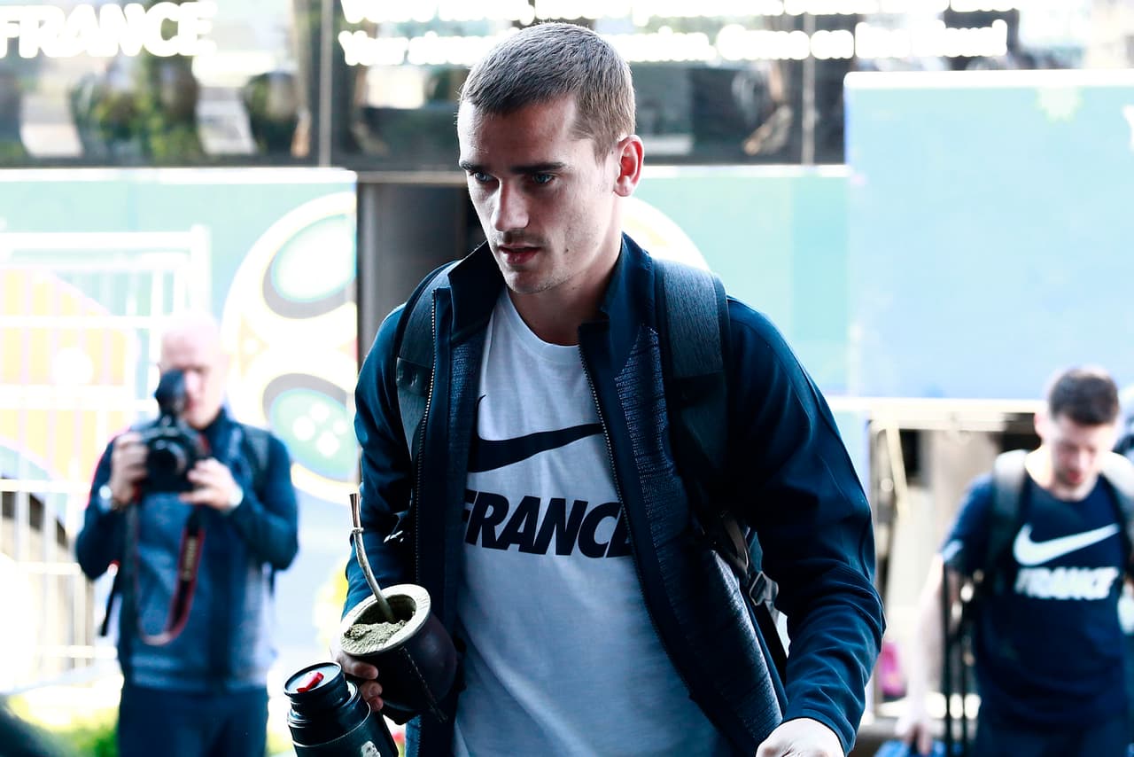 France's forward Antoine Griezmann holding a traditional mate gourd arrives to a hotel in Kazan on June 29, 2018 on the eve of the Russia 2018 World Cup round of 16 football match between France and Uruguay. (Photo by Benjamin CREMEL / AFP) (Photo credit should read BENJAMIN CREMEL/AFP/Getty Images)