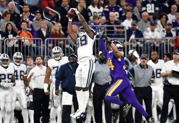 MINNEAPOLIS, MN - DECEMBER 1: Dez Bryant #88 of the Dallas Cowboys makes a leaping catch over Andrew Sendejo #34 of the Minnesota Vikings in the third quarter of the game on December 1, 2016 at US Bank Stadium in Minneapolis, Minnesota. (Photo by Hannah Foslien/Getty Images)
