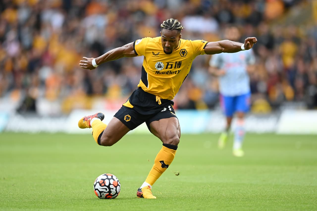 WOLVERHAMPTON, ENGLAND - AUGUST 29: Adama Traore of Wolverhampton Wanderers runs with the ball during the Premier League match between Wolverhampton Wanderers and Manchester United at Molineux on August 29, 2021 in Wolverhampton, England. (Photo by Michael Regan/Getty Images)