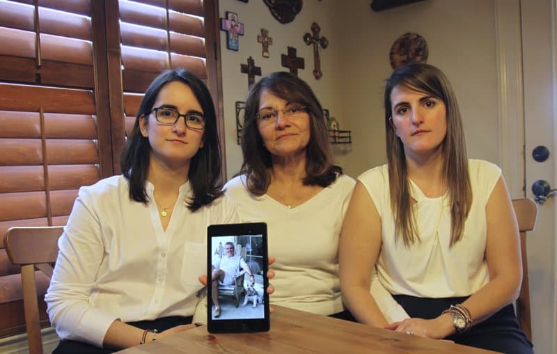 Dennysse Vadell sits between her daughters Veronica, right, and Cristina holding a digital photograph of father and husband Tomeu who is currently jailed in Venezuela with five other executives from Houston-based Citgo.