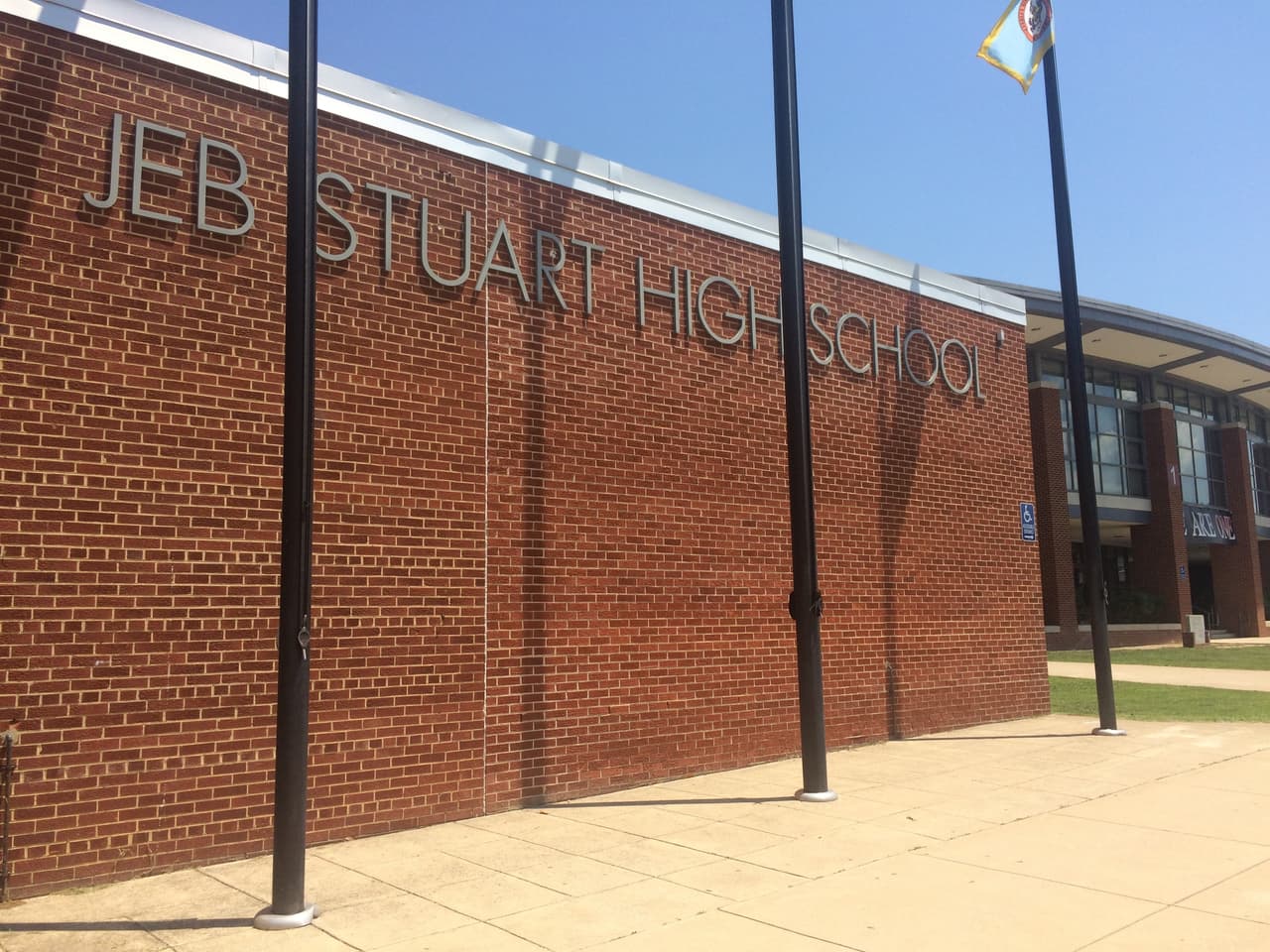 In this photo taken July 20, 2017, the sign for J.E.B. Stuart High School is photographed in Falls Church, Va. A two-year debate over whether to change the name of a northern Virginia high school honoring a Confederate general is coming to an end. The Fairfax County school board is scheduled to vote Thursday, July 27, 2017, on whether to change the name of J.E.B. Stuart High in Falls Church. (AP Photo/Matt Barakat)
