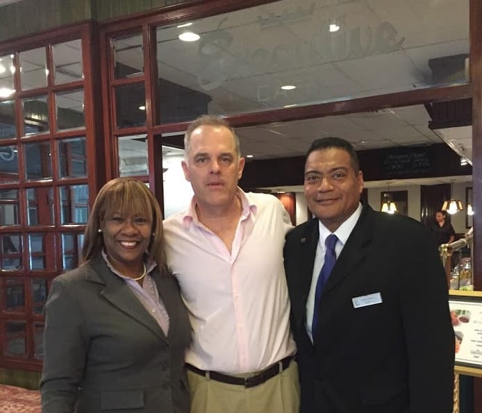 David Adams with staff at the Hotel Ejecutivo in Panama City in 2016. Gisela Velasquez (left) and Carlos Correa (right).