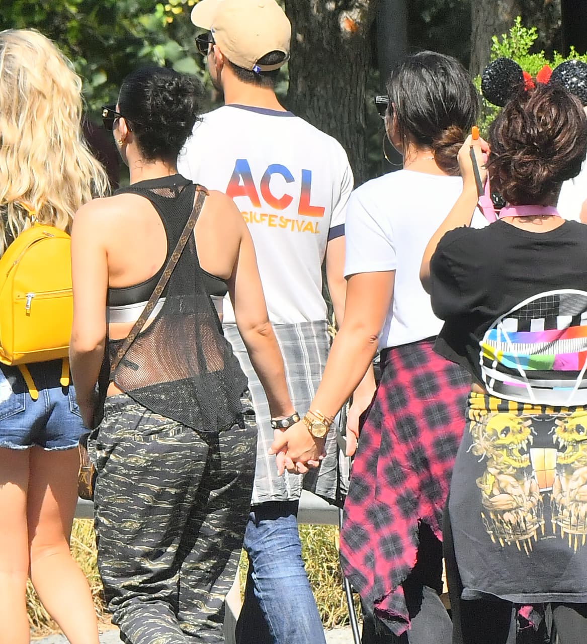 Photo © 2017 Mega/The Grosby Group EXCLUSIVE Los Angeles, CA September 11, 2017 Demi Lovato holds hands with a mystery woman while spending a happy day a Disneyland gets photobombed by Donald Duck. Demi and her new lady walked hand in hand all day Long as they enjoyed a day. they were seen riding the California screaming rollercoaster. Demi looked extremely happy.