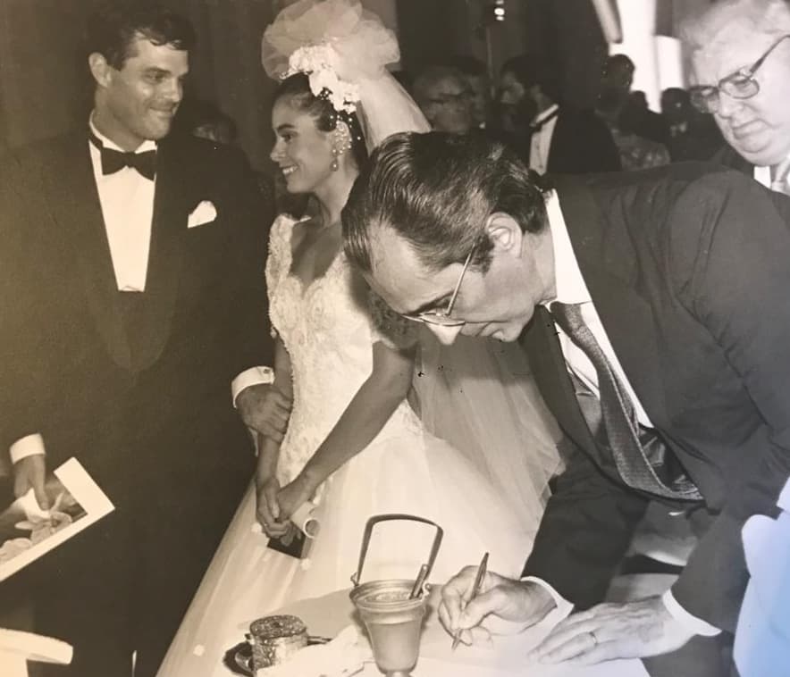 The wedding of David Adams (left) and Ines Lozano (right) at the Iglesia del Carmen August 9, 1991. In photo, the Vice President of Panama, Ricardo Arias Calderon signing the wedding book.