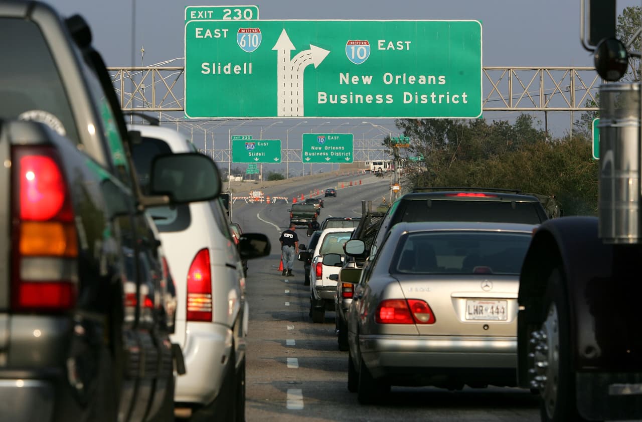 NEW ORLEANS - SEPTEMBER 19: Cars trying to enter New Orleans on Interstate 10 are turned away by police after waiting over an hour September 19, 2005 in New Orleans, Louisiana. New Orleans Mayor C. Ray Nagin announced that a planned re-entry into New Orleans has been suspended due to the new tropical storm Rita which is possibly headed towards the Gulf Coast. (Photo by Justin Sullivan/Getty Images)