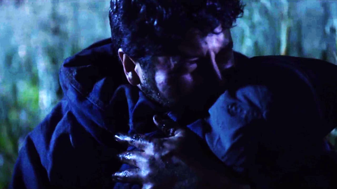 After escaping from the military attacks, the field worker found the son of his murdered workmates and he immediately took him in his arms to save him.