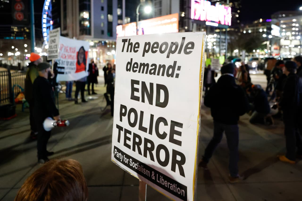 Demonstrators gather during a protest over the death of Tyre Nichols, Friday, Jan. 27, 2023, in Atlanta. (AP Photo/Alex Slitz)