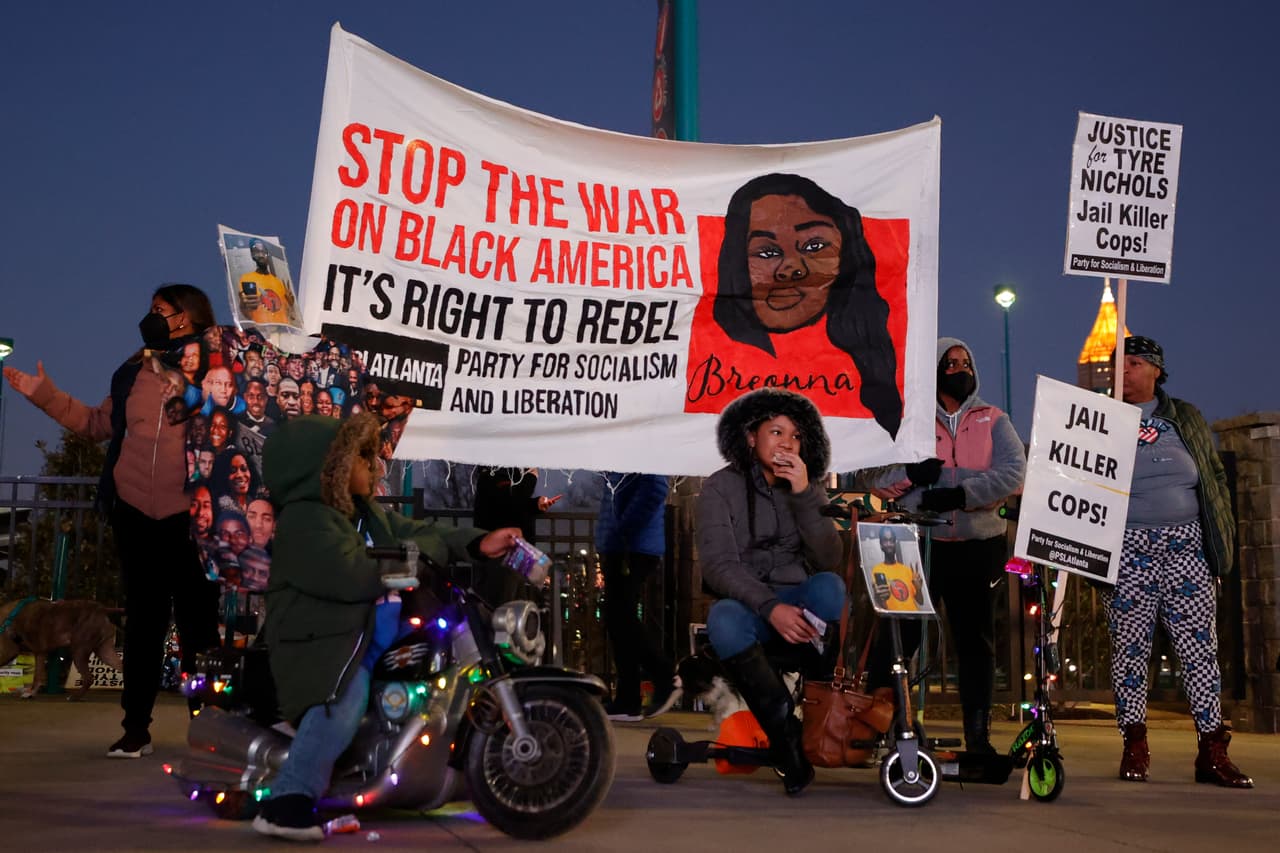 Demonstrators gather during a protest over the death of Tyre Nichols, Friday, Jan. 27, 2023, in Atlanta. (AP Photo/Alex Slitz)