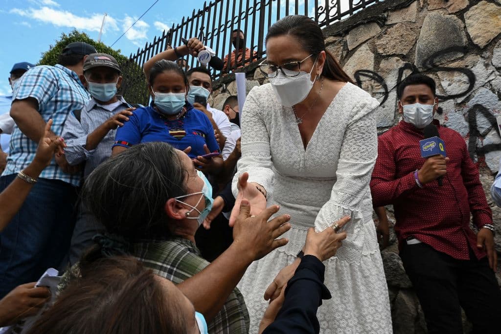 Ana Garcia, the wife of Honduran former President Juan Orlando Hernandez´, greets supporters during a protest outside the Supreme Court of Justice building as he is expected for a hearing, in Tegucigalpa, on March 16, 2022, as part of his extradition process.