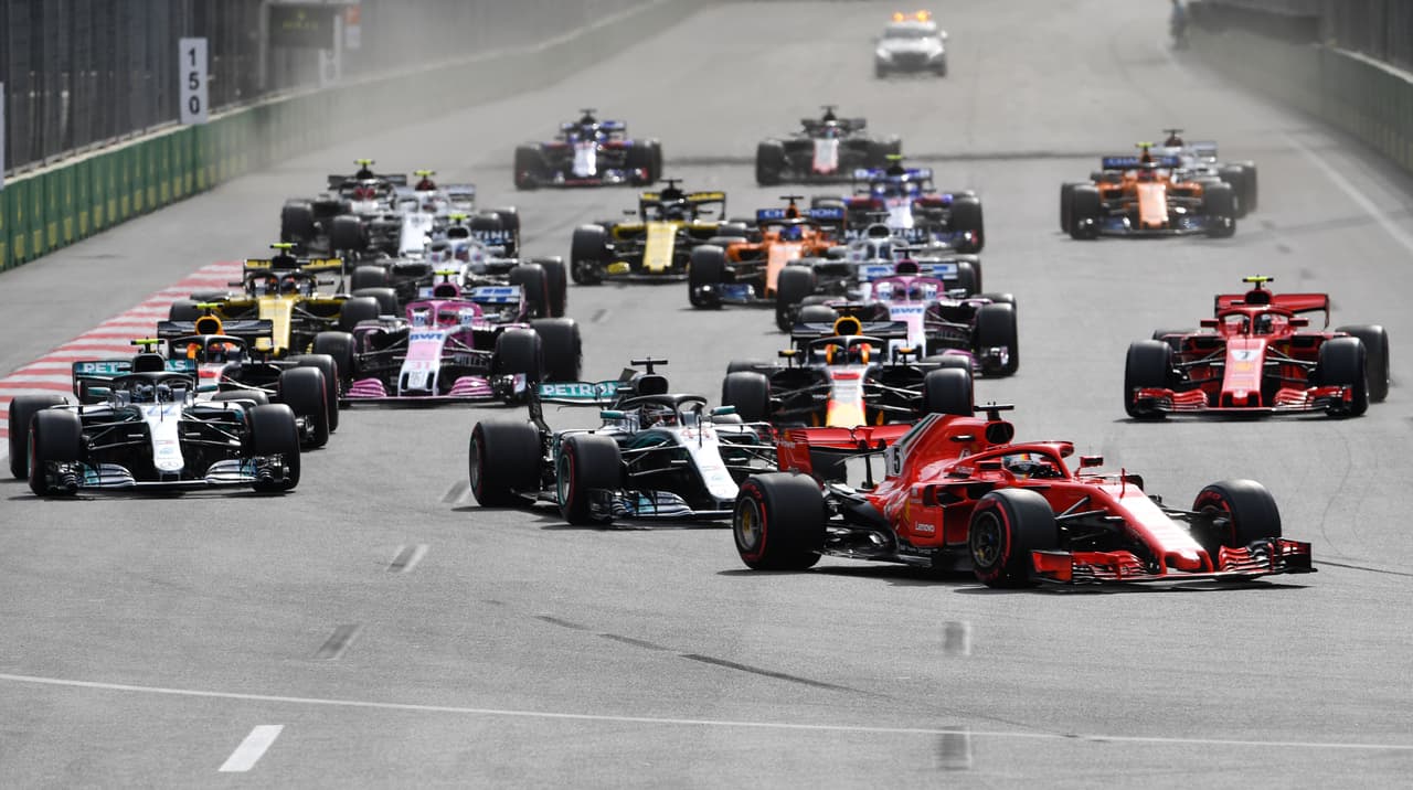 Ferrari's German driver Sebastian Vettel leads the pack at the start of the Formula One Azerbaijan Grand Prix at the Baku City Circuit in Baku on April 29, 2018. (Photo by Andrej ISAKOVIC / AFP) (Photo credit should read ANDREJ ISAKOVIC/AFP/Getty Images)