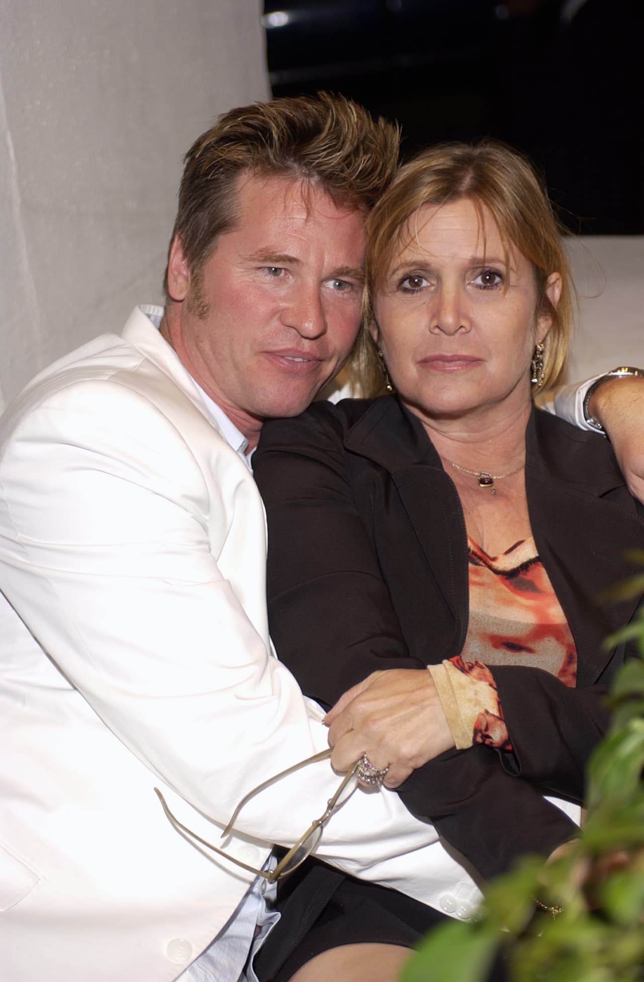 WESTWOOD, CA - MAY 18: (U.S. TABS AND HOLLYWOOD REPORTER OUT) Actor Val Kilmer and actress Carrie Fisher converse at the after-party for the Los Angeles premiere of "Stateside", on May 18, 2004 at The Crest Theatre in Westwood, California. (Photo by Robert Bertoia/Getty Images)
