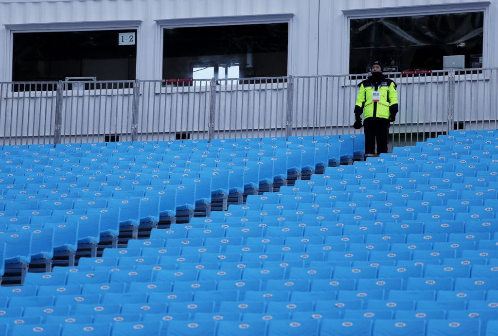 PYEONGCHANG-GUN, SOUTH KOREA - FEBRUARY 11: A Police pofficer stands guard after the Alpine Skiing Men's Downhill event was cancelled due to high winds on day two of the PyeongChang 2018 Winter Olympic Games at Jeongseon Alpine Centre on February 11 in Pyeongchang-gun, South Korea. (Photo by Tom Pennington/Getty Images)