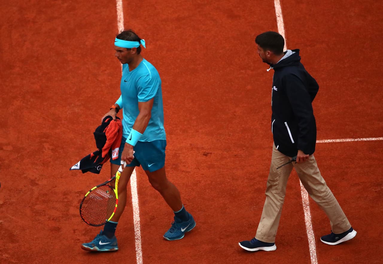 PARIS, FRANCE - MAY 28: Rafael Nadal of Spain leaves the court following a rain delay in his mens singles first round match against Simone Bolelli of Italy during day two of the 2018 French Open at Roland Garros on May 28, 2018 in Paris, France. (Photo by Clive Brunskill/Getty Images)