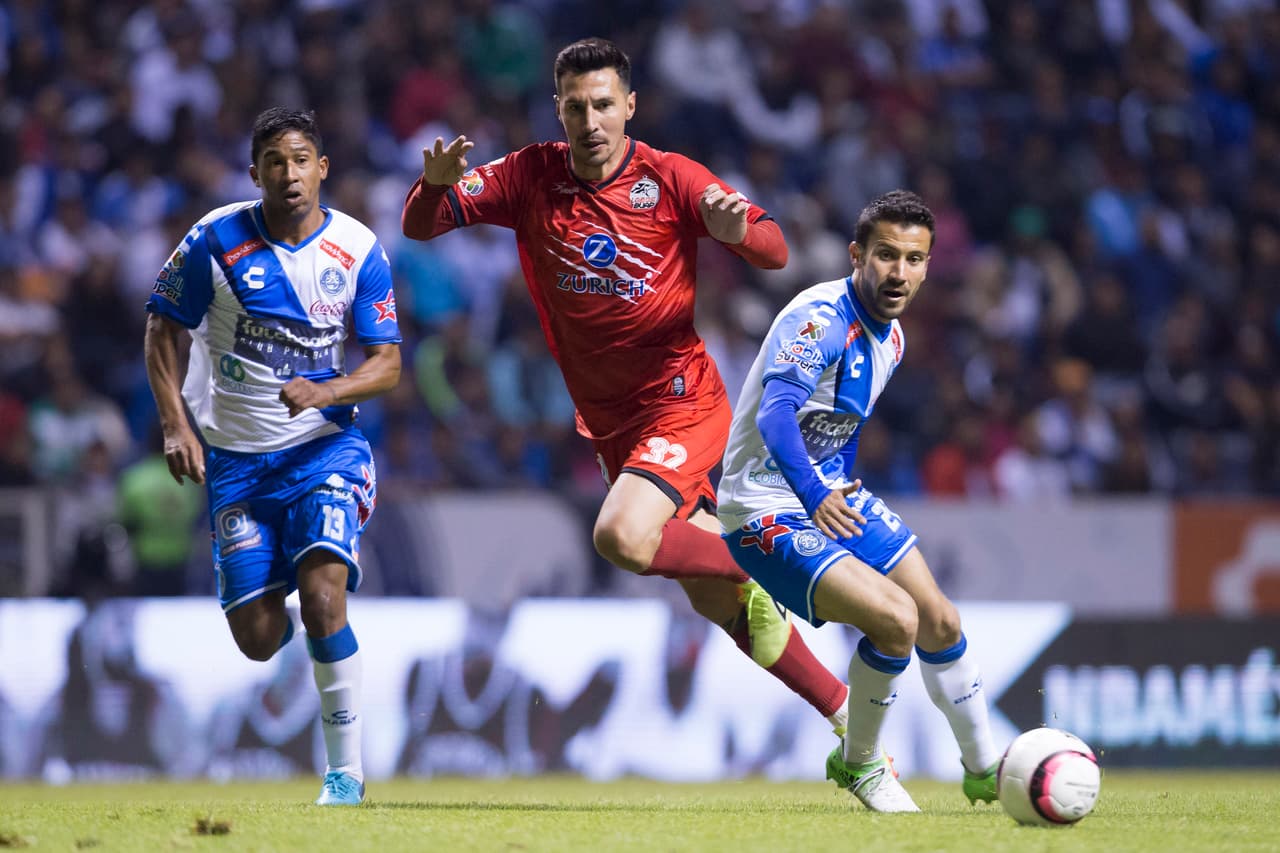 Action photo during the match Puebla vs Lobos BUAP, Corresponding to 17st round of the Apertura Tournament 2017 of Liga BBVA BAncomer MX, at Cuauhtemoc Stadium. Foto de accion durante el partido Puebla vs Lobos BUAP, Correspondiente a la Jornada 17 del Torneo Apertura 2017 de la Liga BBVA BAncomer MX, en el Estadio Cuauhtemoc, en la foto: Christian Marrugo de Puebla, Jonathan fabbro de Lobos y Jose Daniel Guerrero de Puebla 17/11/2017/MEXSPORT/Isabel