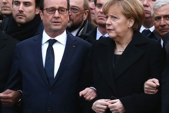 Aquí, el presidente con la canciller alemana Angela Merkel.