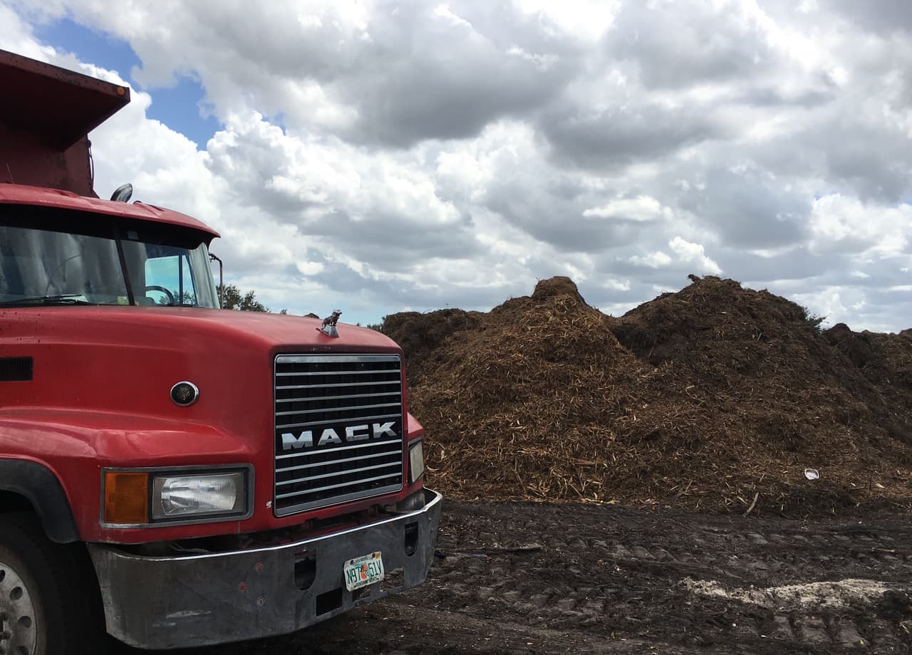 Mulch accumulating at a Miami Lakes debris grinding site.