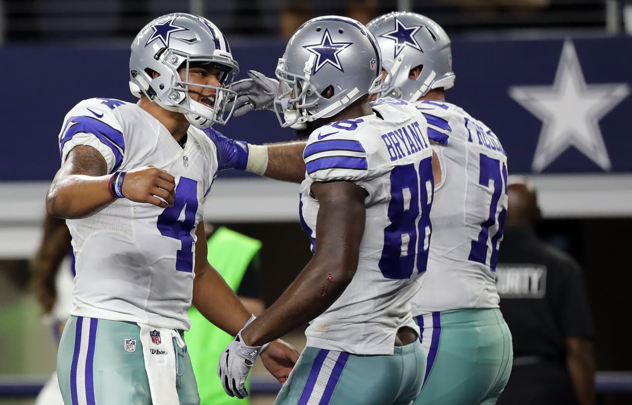 ARLINGTON, TX - OCTOBER 30: (L-R) Dak Prescott #4 celebrates a touchdown with Dez Bryant #88 of the Dallas Cowboys during play against the Philadelphia Eagles at AT&T Stadium on October 30, 2016 in Arlington, Texas. (Photo by Ronald Martinez/Getty Images)
