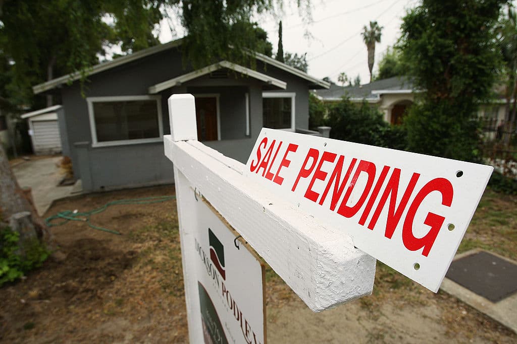 PASADENA, CA - APRIL 23: A sign advertises the pending sale of a house on April 23, 2009 in Pasadena, California. About half of all homes sold last month were sold to first-time homebuyers but hopes of a Spring recovery in the housing market were dampened by a report by the National Association of Realtors that existing home sales fell 3 percent in March despite near-record-low mortgage rates and home prices that are the lowest in years. The median sales price in March was $175,200, down from $200,000 a year ago. (Photo by David McNew/Getty Images)
