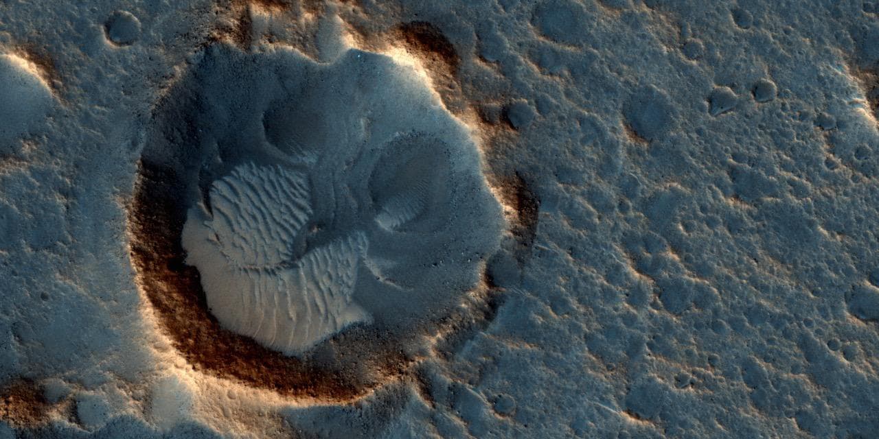 Esta imagen tomada por el orbitador Reconnaissance muestra una ubicación asociada con la famosa novela y película de Hollywood ‘The Martian' (‘El Marciano’, en español). Se encuentra en una región conocida como Acidalia Planitia.