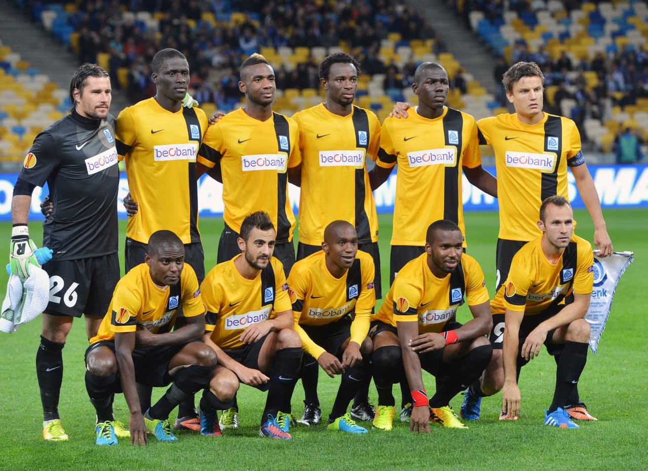 El Genk, campeón belga es equipo de casa, es decir, no son buen equipo jugando fuera de su estadio. Mbwana Samatta es el jugador a seguir. Felice Mazzu es el que lleva las riendas del equipo.