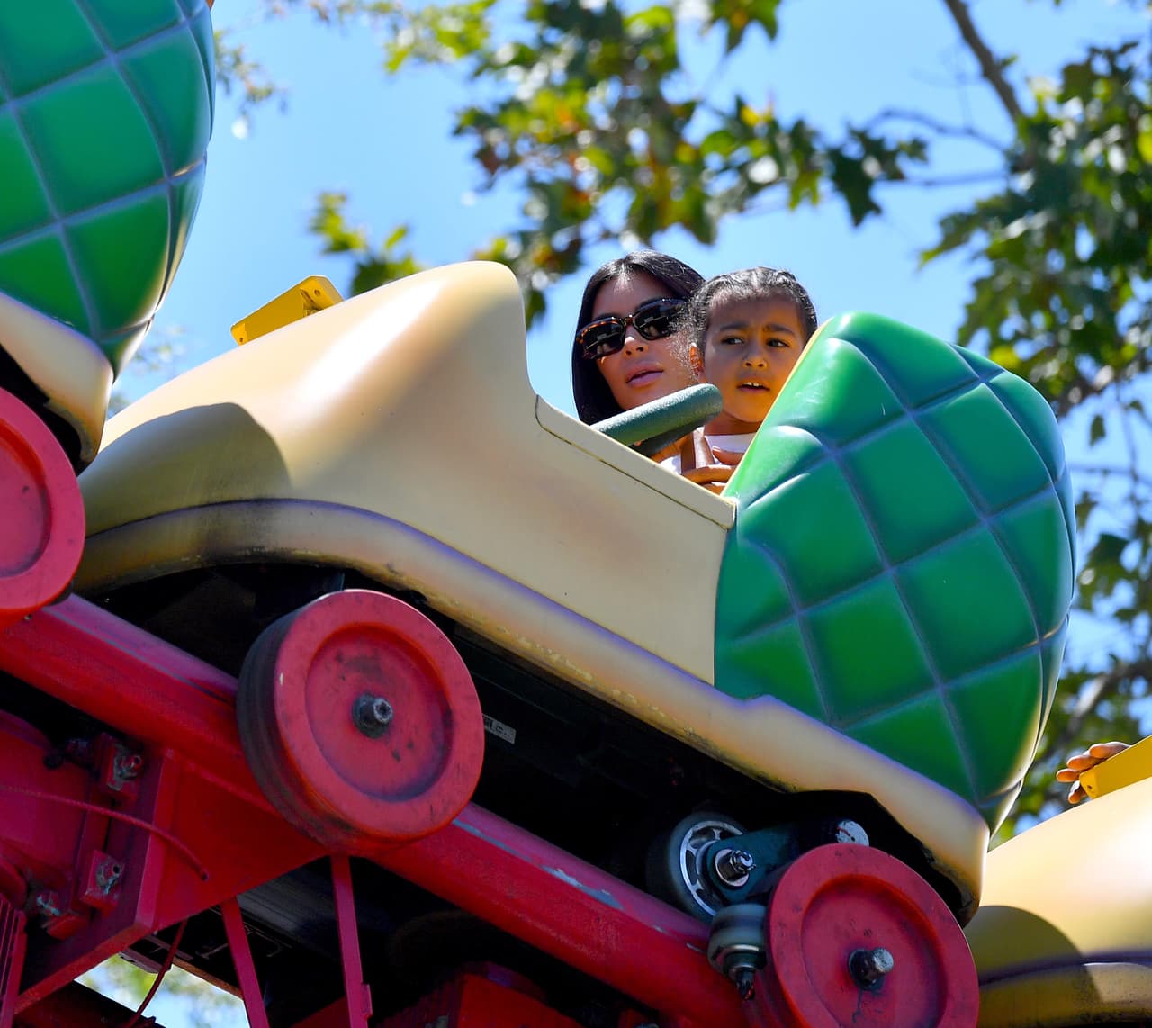 Photo © 2017 Splash News/The Grosby Group EXCLUSIVE Los Angeles, May 23, 2017. Kim Kardashian and Kanye West take their daughter and niece to the happiest place on earth, Disneyland. The group, joined by friends, were seen riding many rides including the teacups, Dumbo, Its a Small World, the gadget go coaster and many other rides on their trip. Kanye even cracked a smile on thunder mountain,