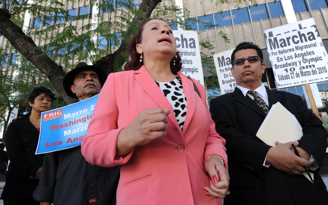 Immigration activists protest as they call for a six-month halt to raids conducted by Immigration and Customs Enforcement, outside the Federal Building in Los Angeles,CA on March 16, 2010. Immigration rights activists claim that deportations have jumped nearly 50 percent under President Barack Obama despite a pledge by the president for a more compassionate immigration policy. A total of 387,790 people were deported from the United States in 2009, up from 264,503 under the administration of President George W. Bush, according to government figures cited by the Fair Immigration Reform Movement, a coalition of several organizations. "We are asking President Obama for an immediate halt to deportations and to show leadership to advance immigration reform," said Angelica Salas, executive director of the Coalition for Humane Immigrant Rights of Los Angeles. AFP PHOTO/Mark RALSTON (Photo credit should read MARK RALSTON/AFP/Getty Images)