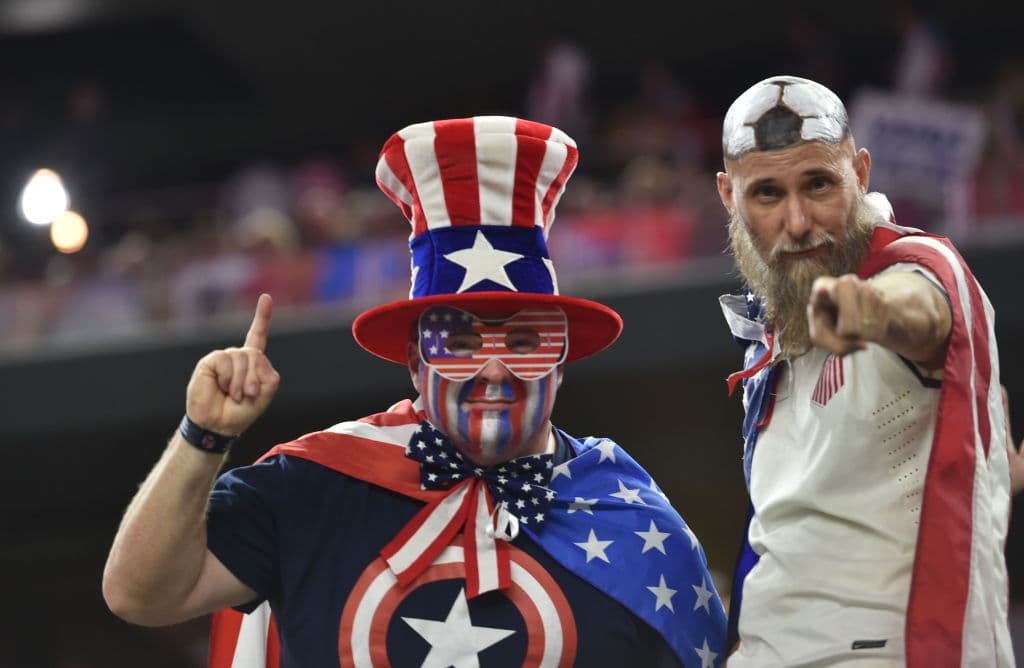 Fans of the USA cheer before the CONCACAF Gold Cup semifinal match against Costa Rica in Arlington, Texas, on July 22, 2017. / AFP PHOTO / Nicholas Kamm (Photo credit should read NICHOLAS KAMM/AFP/Getty Images)
