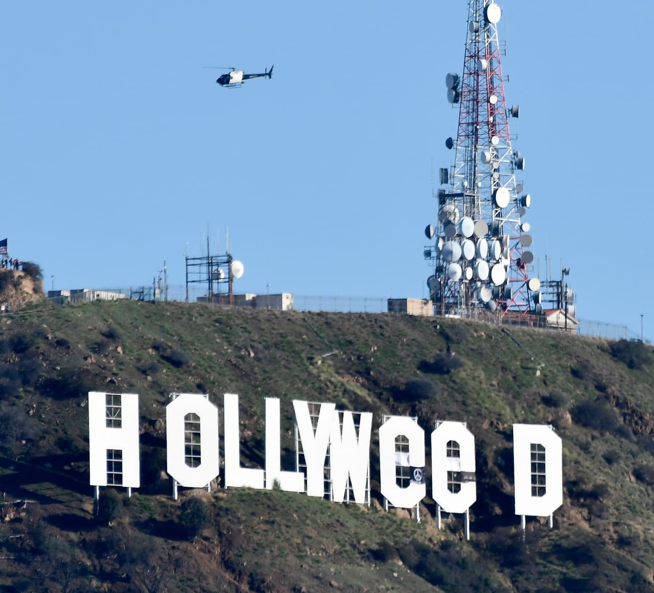The famous Hollywood sign reads "Hollyweed" after it was vandalized, January 1, 2017. Police said unidentified thrill-seekers had climbed up and arranged tarps over the two letter "O's" to make them look like "E's," CBS affiliate KCAL reported. Each letter is 45 feet (13.7 meters) high, so the feat would have required not just bravado but considerable athleticism. / AFP / Gene Blevins (Photo credit should read GENE BLEVINS/AFP/Getty Images)
