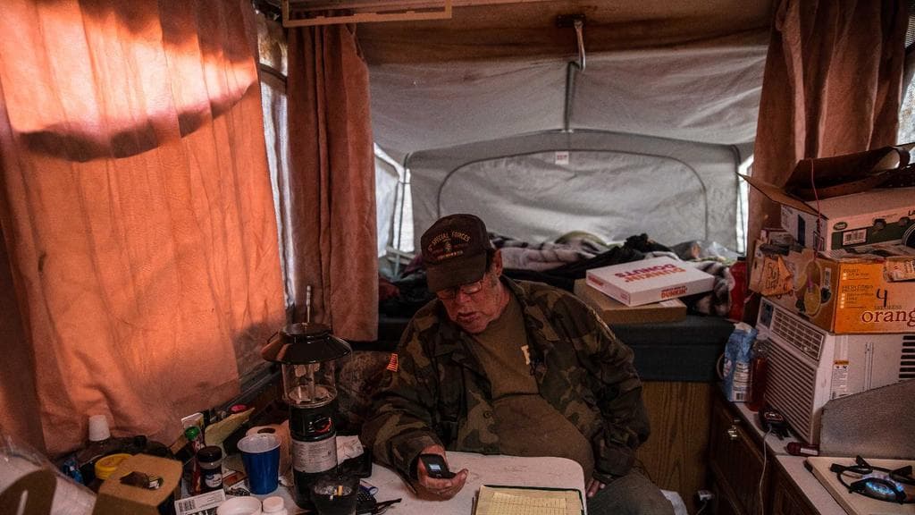 "We need more boots in the field," says the commander of this militia, Johnny Horton Jr., sitting inside the motor home in which he makes almost all his decisions.