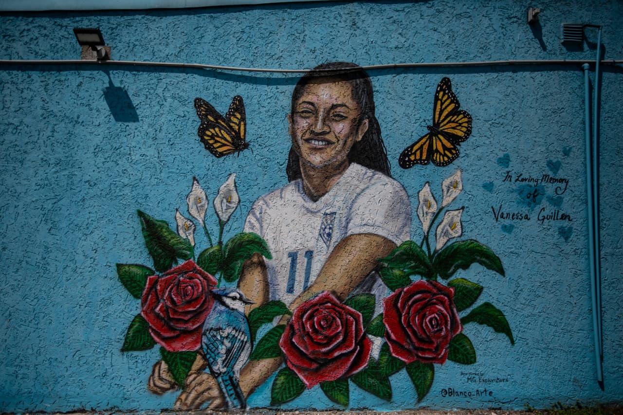 A mural of Vanessa Guillen with red roses and wearing her high school soccer jersey in the parking lot of Guanajuato Barbershop on Harrisburg Blvd, in Houston, Texas.