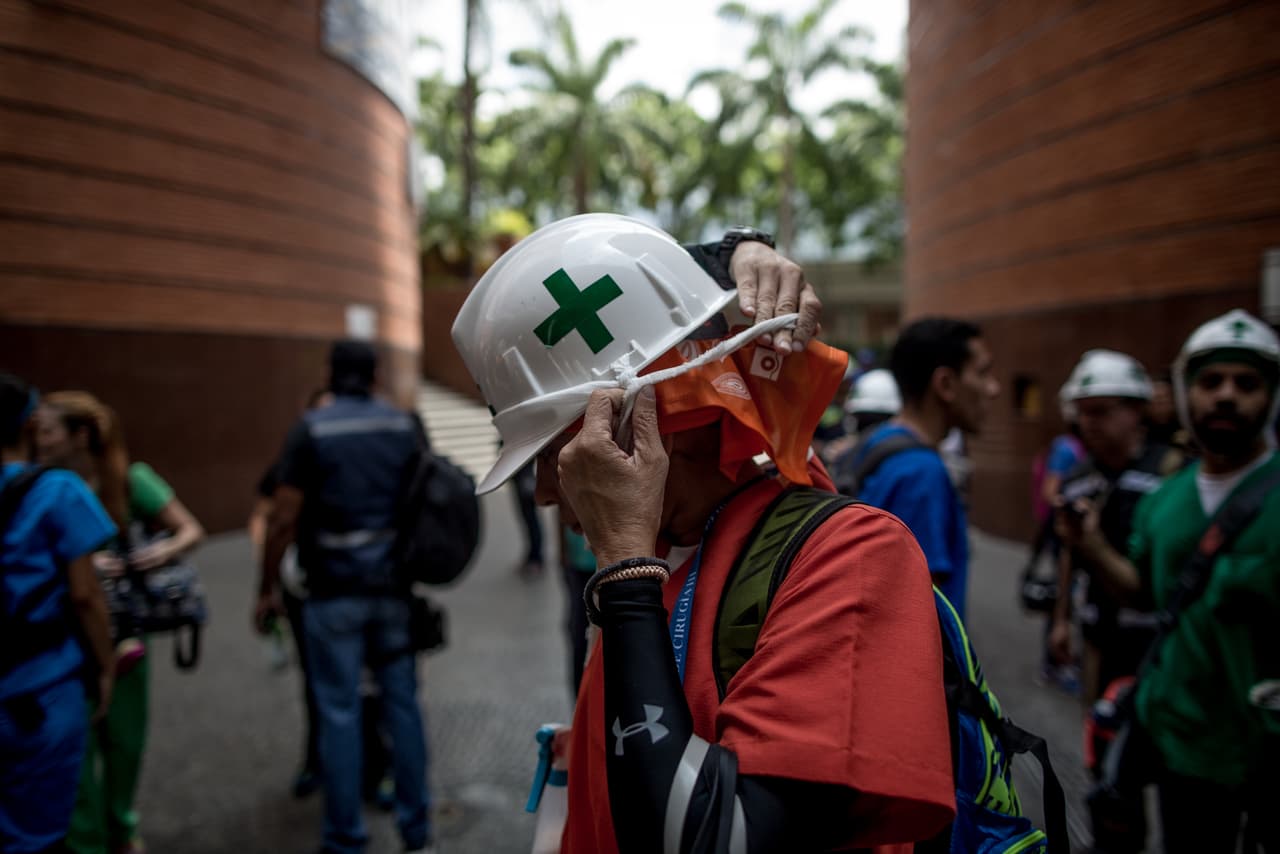 The idea of 'white helmets' emerged in 2014, when the previous wave of protests escalated to more than four dozen dead. The green cross helps identify them in the crowd as many protests wear all manner of hear gear, however they have also come under attack by police during protests.
