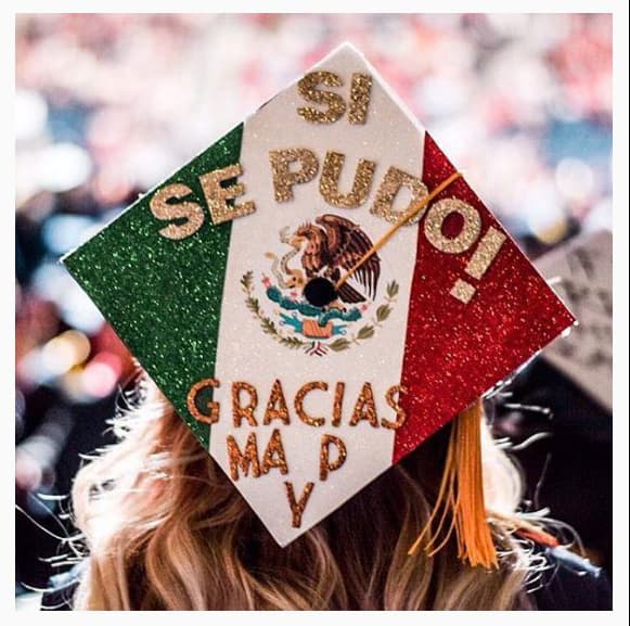 Graduation caps: this one reads "Yes we could. Thanks Mom and Dad" written on the background of the Mexican flag.