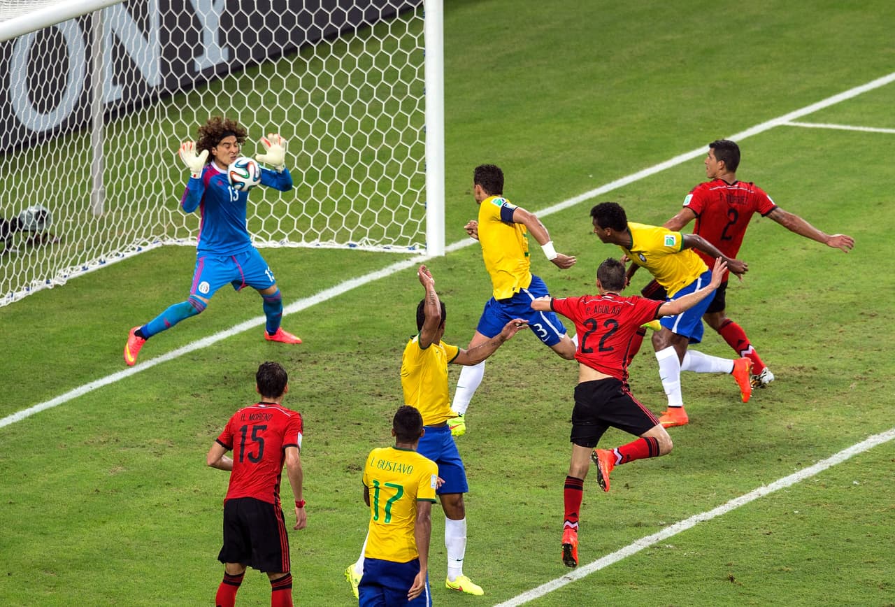 FORTALEZA, BRAZIL - JUNE 17: Guillermo Ochoa of Mexico makes a save after a header by Thiago Silva of Brazil during the 2014 FIFA World Cup Brazil Group A match between Brazil and Mexico at Castelao on June 17, 2014 in Fortaleza, Brazil. (Photo by Miguel Tovar/Getty Images)