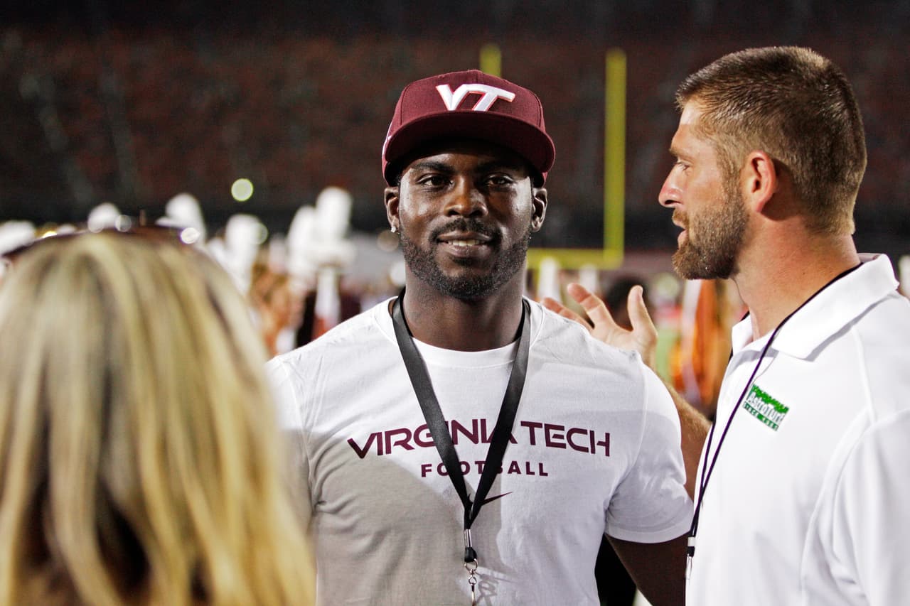 Former Virginia Tech quarterback Michael Vick is seen during an NCAA college football game against Tennessee played at Bristol Motor Speedway Saturday, Sept. 10, 2016, in Bristol, Tenn. (AP Photo/Wade Payne)