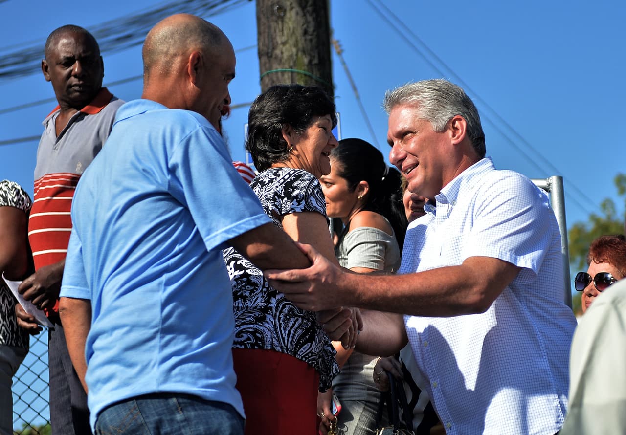 Cuba's First Vice-President Miguel Diaz-Canel (R) greets people as he arrives at a polling station in Santa Clara, Cuba, during an election to ratify a new National Assembly, on March 11, 2018. Cubans vote to ratify a new National Assembly on Sunday, a key step in a process leading to the election of a new president, the first in nearly 60 years from outside the Castro family. The new members of the National Assembly will be tasked with choosing a successor to 86-year-old President Raul Castro when he steps down next month. / AFP PHOTO / Yamil LAGE (Photo credit should read YAMIL LAGE/AFP/Getty Images)