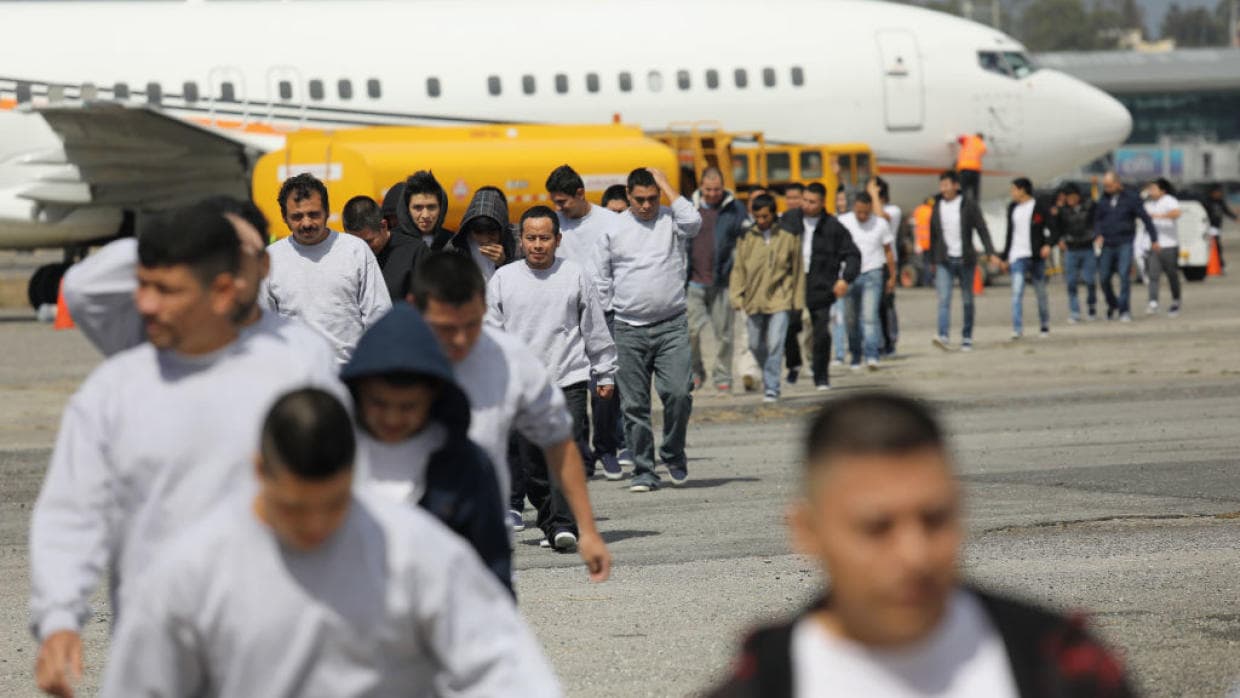 A plane arrives to Guatemala carrying a group of people recently deported from the United States.