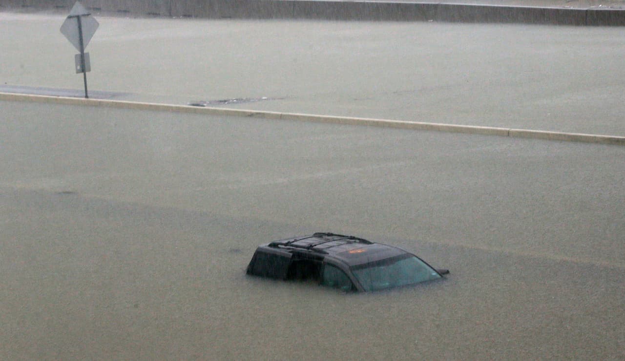 A car is completely submerged. The center of Tropic Storm Harvey is expected to drift back toward the Gulf of Mexico Tuesday, according to the National Weather Service,
<b>"bringing more torrential rainfall to the flooded Houston metro area, piling onto record-breaking, catastrophic flooding."</b>