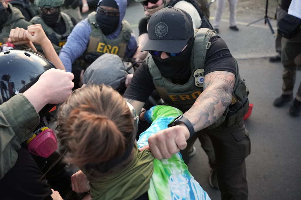 Federal immigration officers clash with protesters outside Delaney Hall detention center Thursday, May 28, 2026, in Newark, N.J. (AP Photo/Angelina Katsanis)