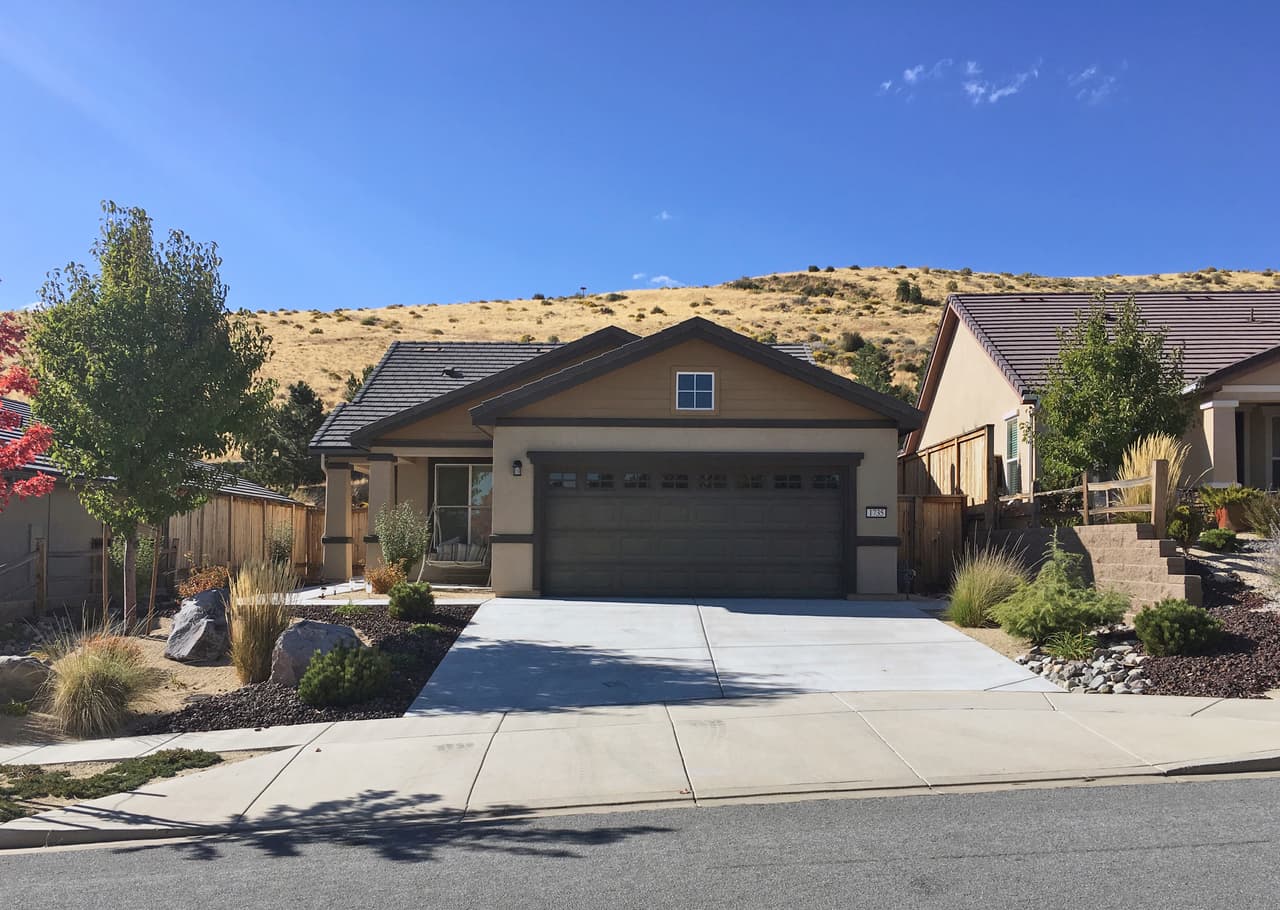 This Wednesday, Oct. 4, 2017 photo shows a home that FBI agents searched Monday in Reno, Nev. The home was owned by Stephen Paddock, who opened fire on a crowd at a country music concert on the Las Vegas Strip on Sunday, killing dozens of people and injuring hundreds of others. (AP Photo/Jonathan Cooper)
