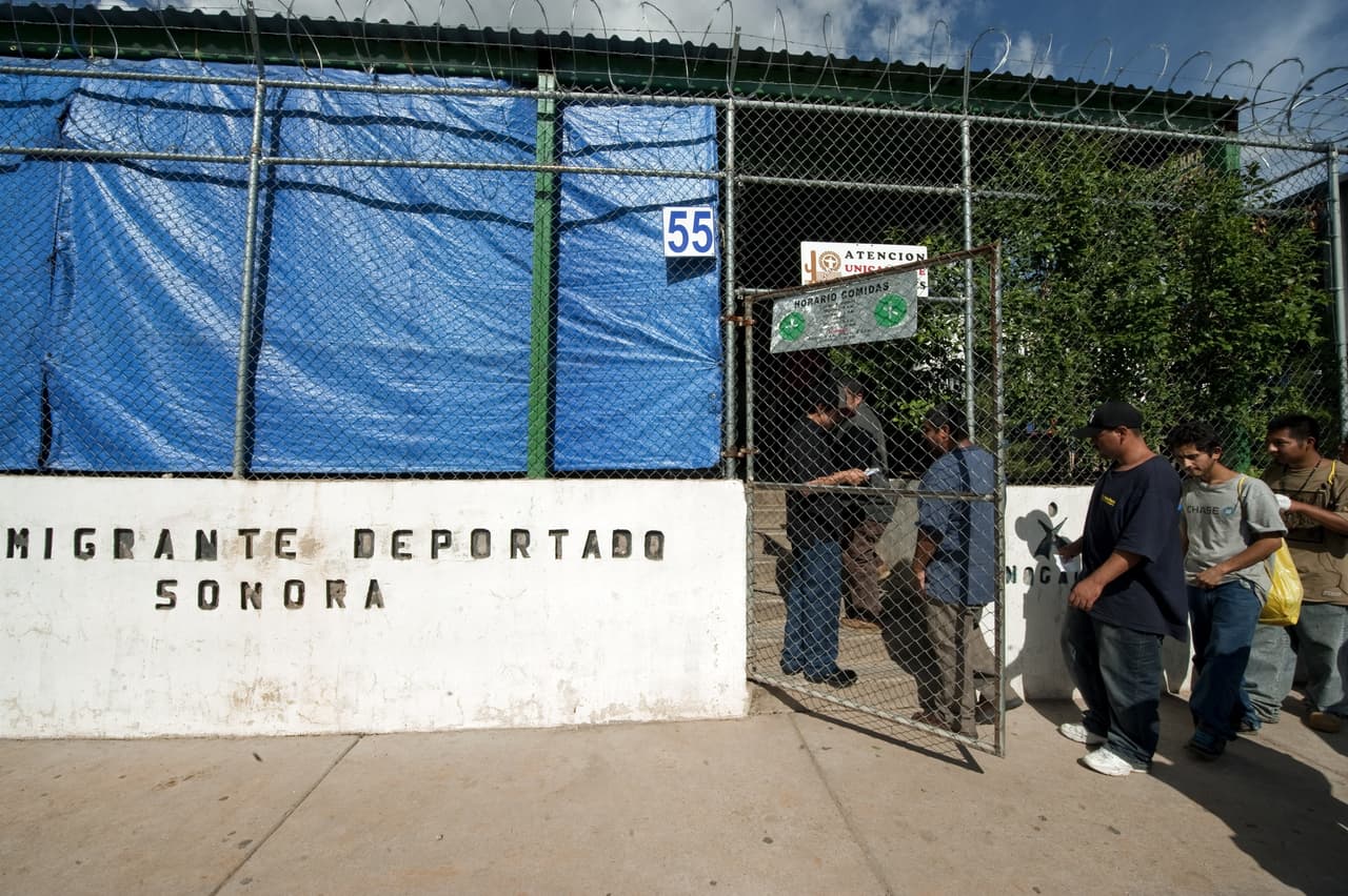A group of illegal immigrans deported from the USA, line up to eat at a shelter near the Mexico-U.S. border, in Nogales, Sonora, Mexico, on July 28, 2010. A US federal judge blocked the most controversial parts of Arizona's new immigration law, barring police from checking the immigrant status of suspected criminals. AFP PHOTO/Alfredo Estrella (Photo credit should read ALFREDO ESTRELLA/AFP/Getty Images)