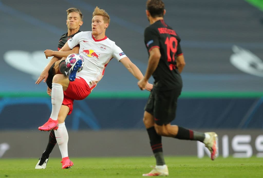 Atletico Madrid's Spanish midfielder Marcos Llorente (L) vies with Leipzig's German defender Marcel Halstenberg during the UEFA Champions League quarter-final football match between Leipzig and Atletico Madrid at the Jose Alvalade stadium in Lisbon on August 13, 2020. (Photo by Miguel A. Lopes / POOL / AFP) (Photo by MIGUEL A. LOPES/POOL/AFP via Getty Images)