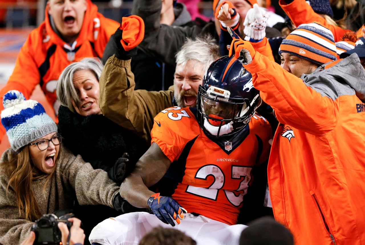 FILE - In this Jan. 3, 2016, file photo, Denver Broncos running back Ronnie Hillman celebrates with fans after scoring during the Broncos' NFL football game against the San Diego Chargers in Denver. Hillman and his backfield mate, C.J. Anderson, have formed a dynamic duo for the Broncos this past regular season, each player rushing for more than 700 yards. (AP Photo/David Zalubowski, File)
