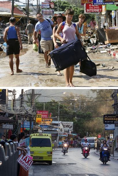 El 27 de diciembre de 2004 los turistas caminaban entre la devastación, con equipaje en mano junto a la playa Patog para salir del país tras el mortal terremoto de magnitud 9 en escala de Richter. En la imagen de abajo automóviles y taxis viajan a lo largo de la concurrida carretera de Patog.