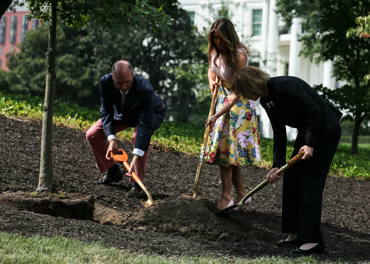 First lady Melania Trump center takes part in a tree planting ceremony on the south grounds of the White House August 27, 2018 in Washington, DC. The tree comes from the original Eisenhower Oak located near the Kennedy Garden that was excavated from the grounds earlier this year. Joining the first lady is Mary Jean Eisenhower, right, granddaughter of President Dwight Eisenhower and Richard Gatchell Jr., left, fifth generation grandson of President James Monroe. (Photo by Oliver Contreras/SIPA USA)