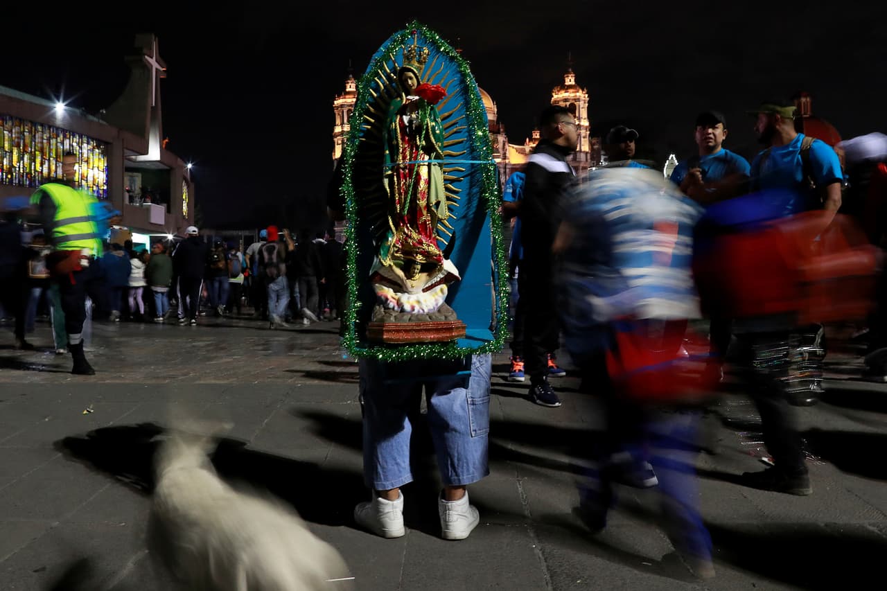 A man stands with an image of the Virgin of Guadalupe at the Basilica of Guadalupe during the annual pilgrimage in honor of the Virgin of Guadalupe, patron saint of Mexican Catholics, in Mexico City, Mexico December 11, 2019. REUTERS/Carlos Jasso