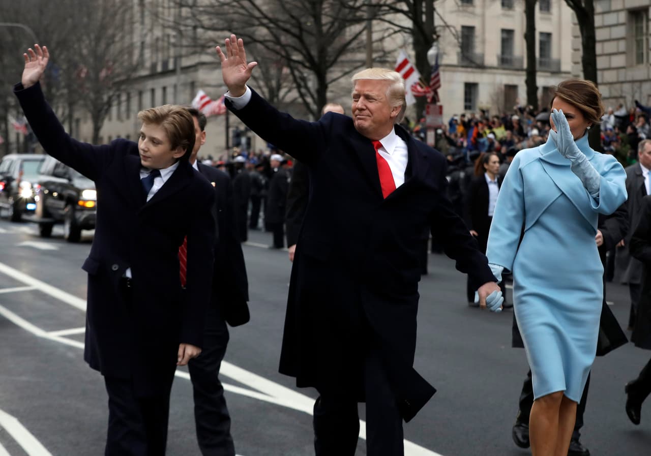 WASHINGTON, DC - JANUARY 20: U.S. President Donald Trump waves to supporters as he walks the parade route with first lady Melania Trump and son Barron Trump after being sworn in at the 58th Presidential Inauguration January 20, 2017 in Washington, D.C. Donald J. Trump was sworn in today as the 45th president of the United States (Photo by Evan Vucci - Pool/Getty Images)