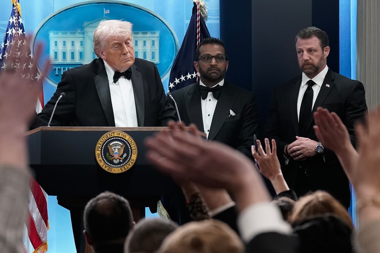 President Donald Trump speaks in the James Brady Press Briefing Room at the White House after an unspecified threat at the annual White House Correspondents' Association Dinner in Washington, Saturday, April 25, 2026, as FBI director Kash Patel and Homeland Security Secretary Markwayne Mullin listen. (AP Photo/Jose Luis Magana)