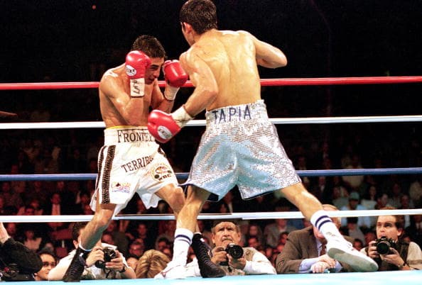 19 Feb 2000: Marco Barrera swings to land a left punch during the WBC/WBO Super Bantamwight Championship against Erik Morales in Las Vegas, Nevada. Morales won by a decision in the 12th round. Mandatory Credit: Jed Jacobsohn /Allsport